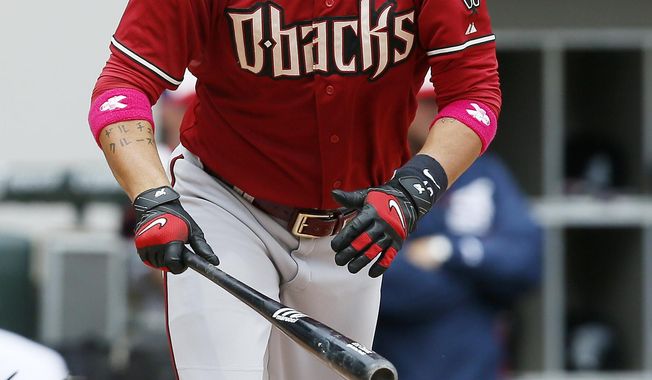 Arizona Diamondbacks designated hitter Eric Chavez hits a single against the Chicago White Sox during the fourth inning of a baseball game on Sunday, May 11, 2014, in Chicago. (AP Photo/Andrew A. Nelles)