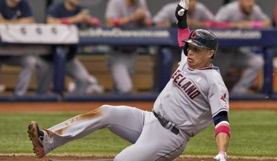 Cleveland Indians&#39; Asdrubal Cabrera scores on Nyjer Morgan&#39;s RBI-single during the second inning of a baseball game against the Tampa Bay Rays, Sunday, May 11, 2014, in St. Petersburg, Fla. (AP Photo/Steve Nesius)