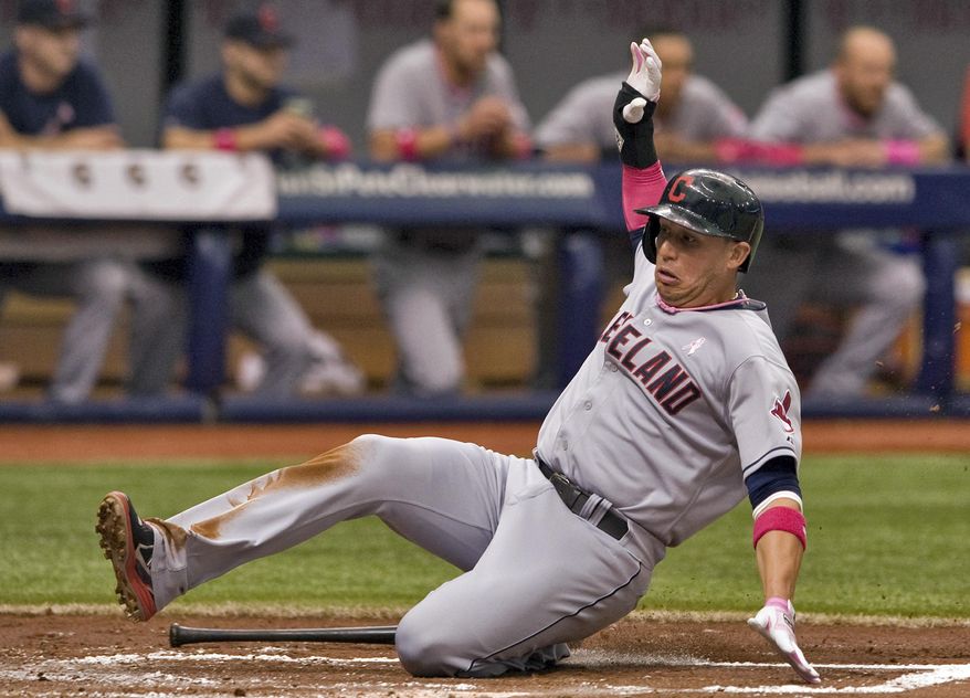 Cleveland Indians&#x27; Asdrubal Cabrera scores on Nyjer Morgan&#x27;s RBI-single during the second inning of a baseball game against the Tampa Bay Rays, Sunday, May 11, 2014, in St. Petersburg, Fla. (AP Photo/Steve Nesius)