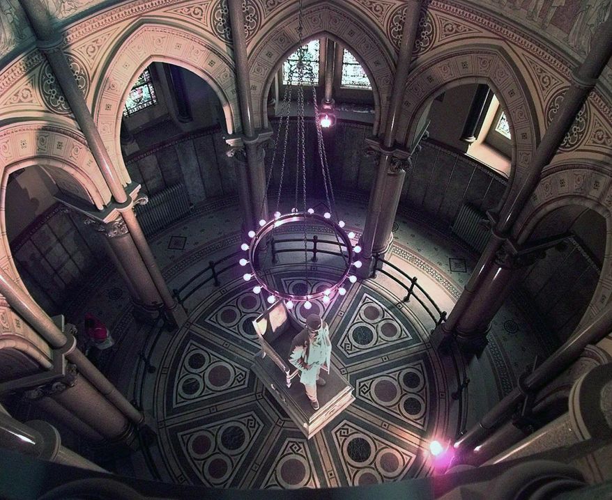 FILE- This Aug. 26, 1998 file photo shows a marble statue of America's 20th President, James A. Garfield, in the center of the James A. Garfield Monument at Lake View Cemetery in Cleveland. Northeast Ohio Media Group on Friday, May 9, 2014 reported that police said thieves broke into the monument and stole a set of commemorative spoons. A cemetery worker discovered the theft Wednesday, May 7, 2014. (AP Photo/Amy Sancetta, File)