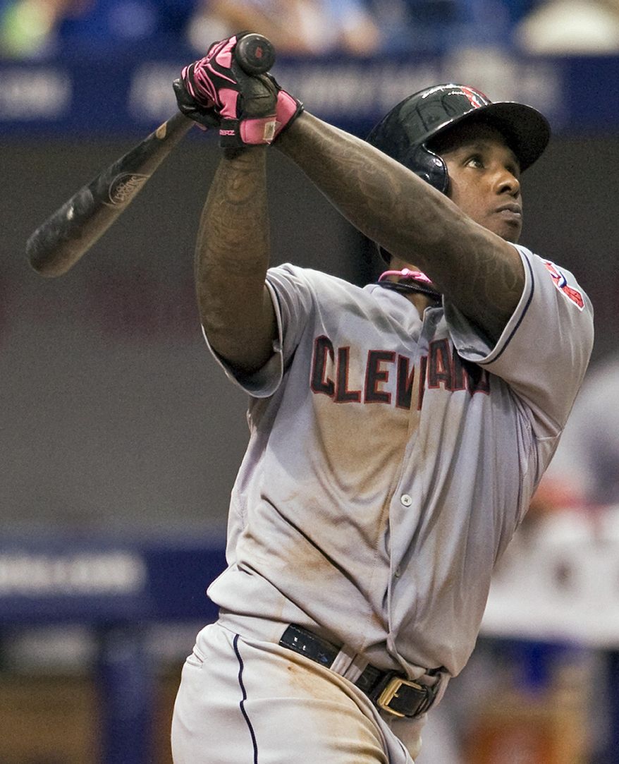 Cleveland Indians&#x27; Nyjer Morgan watches his solo home run hit off Tampa Bay Rays reliever Brandon Gomes during the eighth inning of a baseball game on Sunday, May 11, 2014, in St. Petersburg, Fla. (AP Photo/Steve Nesius)