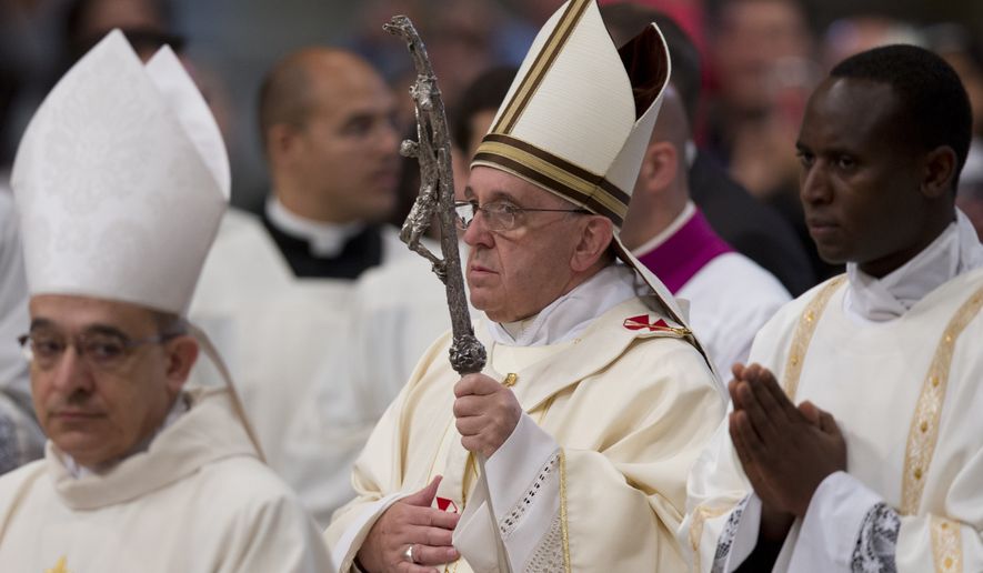 Pope Francis arrives to celebrate a Mass where he ordained 13 new priests in St. Peter's Basilica at the Vatican, Sunday, May 11, 2014. (AP Photo/Andrew Medichini)