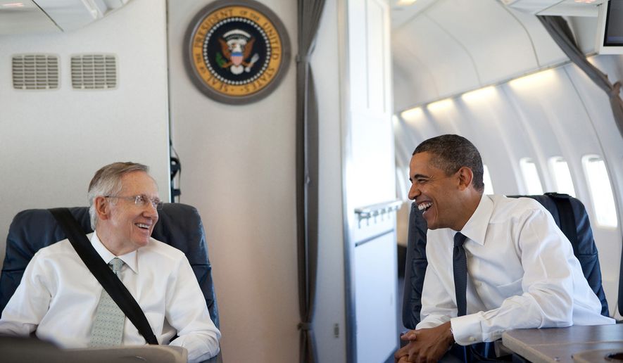 President Barack Obama talks with Senate Majority Leader Harry Reid, D-Nev. aboard Air Force One, en route to West Virginia for Sen. Robert Byrd&#39;s memorial service, July 2, 2010. (Official White House Photo by Pete Souza)