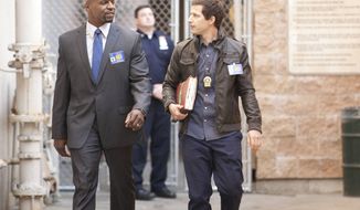 This image released by Fox shows Terry Crews, left, and Andy Samberg in a scene from &amp;quot;Brooklyn Nine-Nine.&amp;quot; Fox will break up its Sunday animation block by moving in the critical favorite “Brooklyn Nine Nine,” and is replacing two of its Tuesday night comedies with an unscripted show that imagines people setting up a new society in an undeveloped area. (AP Photo/Fox, John Fleenor)