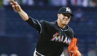 Miami Marlins starting pitcher Jose Fernandez works the first inning against the San Diego Padres during a baseball game on Friday, May 9, 2014, in San Diego. (AP Photo/Lenny Ignelzi)