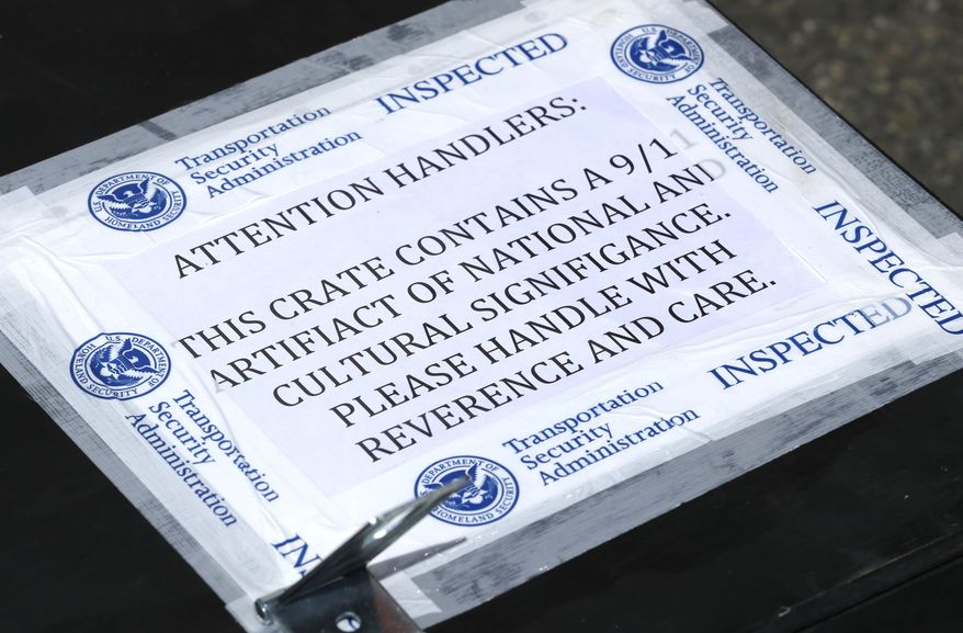 A label is shown on a shipping box, Monday, May 12, 2014, that carried a piece of limestone that was part of the building at the Pentagon in Washington, DC, before it was destroyed in the September 11, 2001 terrorist attacks. The stone was delivered during a ceremony at the Alaska Airlines cargo facility in Seatac, Wash., and will be part of a Sept. 11th memorial in Federal Way, Wash. that will be dedicated on Sept. 11, 2014, and also contains a beam from the World Trade Center in New York and a rock from the field in Shanksville, Pa., where United flight 93 crashed during the attacks. (AP Photo)