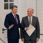 U.S. President Ronald Reagan gestures as Soviet leader Mikhail Gorbachev looks on after their third session of talks at the Hofdi in Reykjavik, Oct. 12, 1986. (AP Photo/Ron Edmonds)