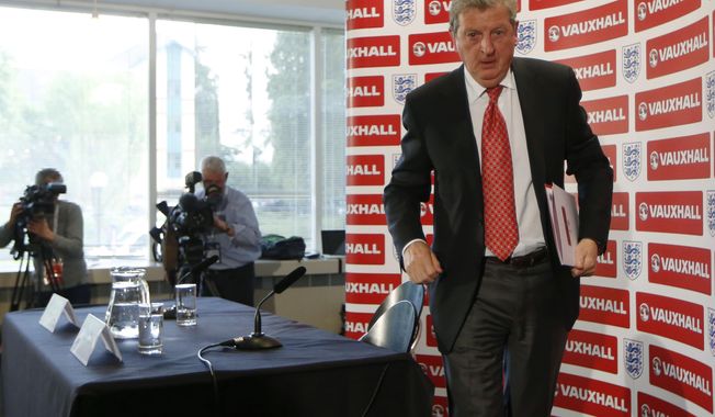 England&#x27;s soccer manager Roy Hodgson leaves, after announcing the squad for the World Cup in Brazil at Vauxhall headquarters,  in Luton, England, Monday, May 12, 2014.  England coach Roy Hodgson selected a World Cup squad containing several young players on Monday, although Frank Lampard was among the veterans to still make the cut. (AP Photo/Sang Tan)