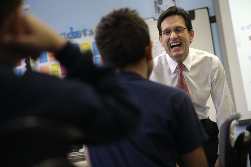 House Majority Leader Eric Cantor laughs while talking with students at the Bronx Charter School of Excellence in New York, Monday, May 12, 2014. Cantor visited the New York City charter school as part of his national education policy tour. (AP Photo)
