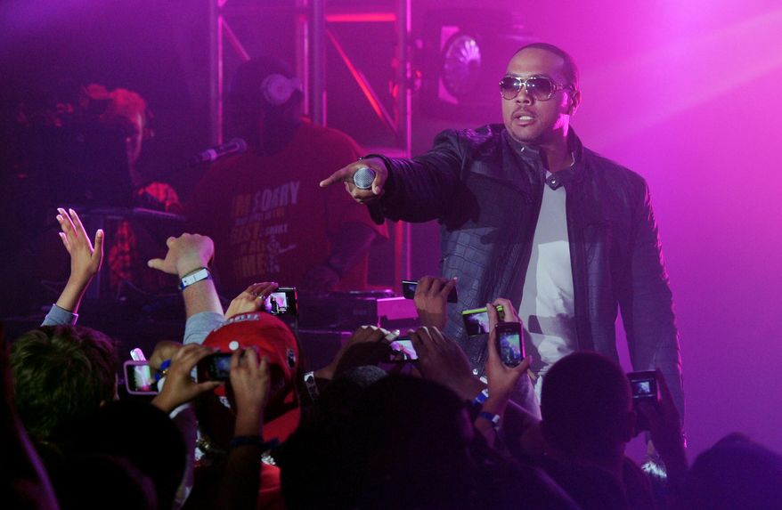 FILE - In this June 23, 2010, file photo, Timbaland performs at a graduation party for students at Culver City High School in Culver City, Calif. Pepsi is pairing singers and filmmakers to release a visual album that celebrates soccer during World Cup. Spike Lee, Timbaland, Idris Elba and Kelly Rowland are some of the artists whose work is featured on the Pepsi-curated album, "Beats of the Beautiful Game," to be released June 10, 2014. The soda company announced Monday, May 12 its album will be a collection of 11 anthem-like songs and short films. (AP Photo/Kristian Dowling, File)