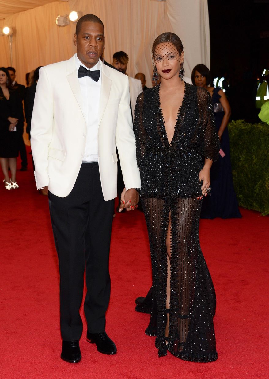 FILE - This May 5, 2014 file photo shows Jay Z, left, and Beyonce at The Metropolitan Museum of Art&#x27;s Costume Institute benefit gala celebrating &amp;quot;Charles James: Beyond Fashion&amp;quot; in New York. The Standard Hotel in New York City says it is investigating the leak of a security video that appears to show Beyonce&#x27;s sister, Solange, attacking Jay Z. Asked about the video on Monday, May 12, by The Associated Press, the hotel issued a statement saying it is &amp;quot;shocked and disappointed that there was a clear breach of our security system.&amp;quot; (Photo by Evan Agostini/Invision/AP, File)