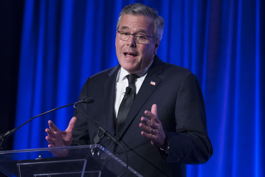 Former Florida Gov. Jeb Bush speaks at the Manhattan Institute for Policy Research Alexander Hamilton Award Dinner, Monday, May 12, 2014, in New York. Bush and Rep. Paul Ryan, R-Wis., courted some of Wall Street&amp;#8217;s most powerful political donors Monday night, competing for attention from tuxedoed hedge fund executives gathered in midtown Manhattan as the early jockeying in the 2016 presidential contest quietly continues. (AP Photo/John Minchillo)