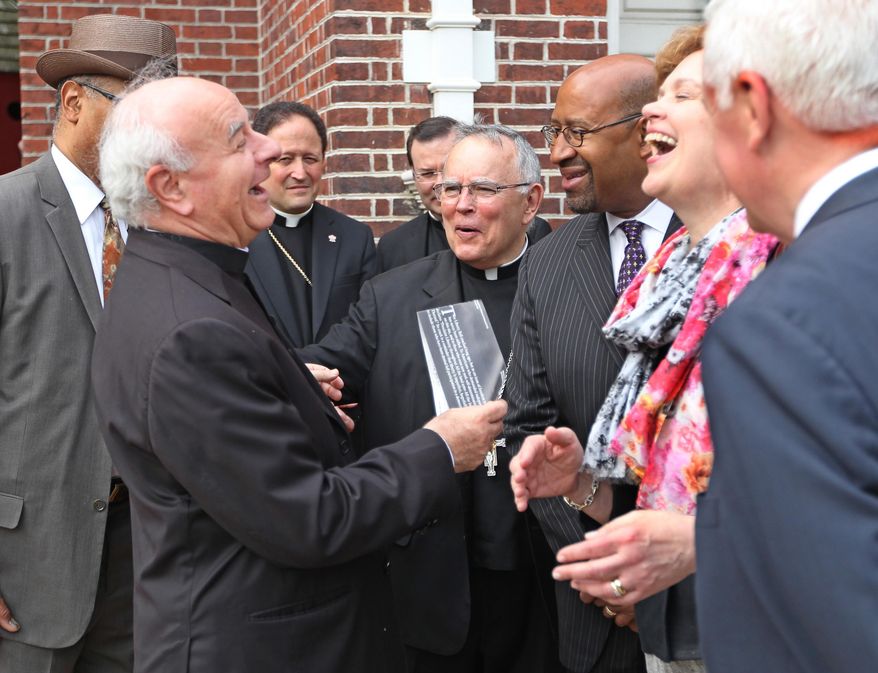 Outside of Independence Hall Archbishop Vincenzo Paglia, left, shares a laugh with Archbishop Charles Chaput, center, Mayor Michael Nutter, second from right, and Susan Corbett, right, during their tour of the city on Tuesday, May 13, 2014. Council president Archbishop Vincenzo Paglia is touring Philadelphia ahead of a major Roman Catholic gathering that the city's archbishop believes will include an appearance by the pope. (AP Photo/The Philadelphia Inquirer, Michael Bryant) PHIX OUT; TV OUT; MAGS OUT; NEWARK OUT