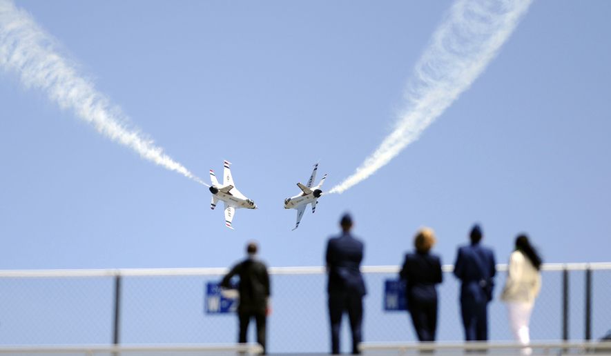 The U.S. Air Force Thunderbirds execute a maneuver while visitors watch from Falcon Stadium after the graduation ceremonies of the Class of 2009. This was the 51st graduating class, and consisted of 1,046 newly commissioned 2nd Lieutenants (US Air Force photo by Dennis Rogers)