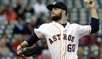 Houston Astros&#39; Dallas Keuchel delivers a pitch against the Texas Rangers in the first inning of a baseball game Tuesday, May 13, 2014, in Houston. (AP Photo)