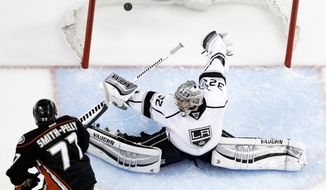 Anaheim Ducks right wing Devante Smith-Pelly, left, scores past Los Angeles Kings goalie Jonathan Quick during the second period in Game 5 of an NHL hockey second-round Stanley Cup playoff series in Anaheim, Calif., Monday, May 12, 2014. (AP Photo/Chris Carlson)