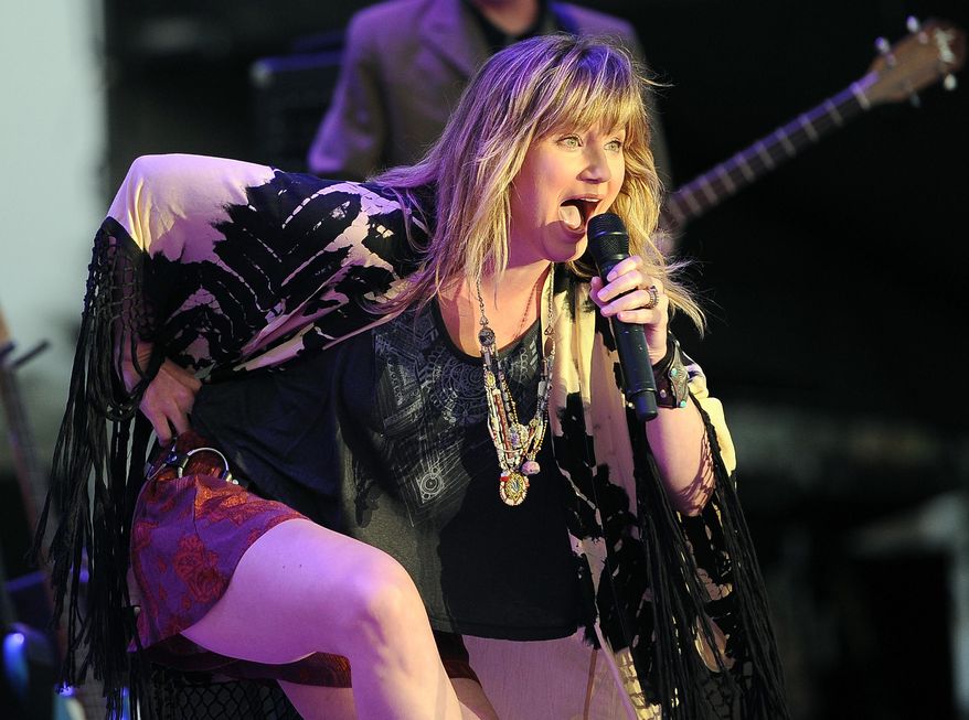 FILE - In this April 26, 2014 file photo, Jennifer Nettles performs during day two of the 2014 Stagecoach Music Festival at the Empire Polo Field in Indio, Calif. Nettles will join the lineup of performers at the National Memorial Day Concert on the Capitol lawn in Washington. Organizers announced Tuesday, May 13, 2014, that Nettles will perform a musical tribute for returning veterans from Afghanistan, who will join her on stage at the Memorial Day concert May 25. (Photo by Chris Pizzello/Invision/AP)