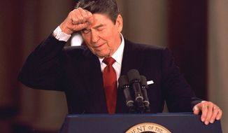 FILE - In this March 19, 1987 file photo, President Ronald Reagan taps his forehead at the White House while responding to a reporter&#39;s question during a news conference at which he said he never deliberately lied to the public, despite admitting to a misstatement about Israeli involvement in the Iran-Contra affair. In a 1986 radio address admitting to missteps in the Iran-Contra scandal, the president famously said &amp;quot;mistakes were made&amp;quot; - a passive acknowledgement of wrongdoing that didn&#39;t directly implicate anyone. (AP Photo/Dennis Cook, File)