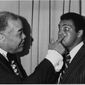 Former heavyweight champion Joe Louis, left, playfully jabs a finger under the eye of present champ Muhammad Ali, at the Boxing Writers Association&#39;s 50th Anniversary dinner in New York, May 19, 1975.  Ali was named Fighter of the Year and Louis was honored as boxing&#39;s Man of the Half Century.  (AP Photo)