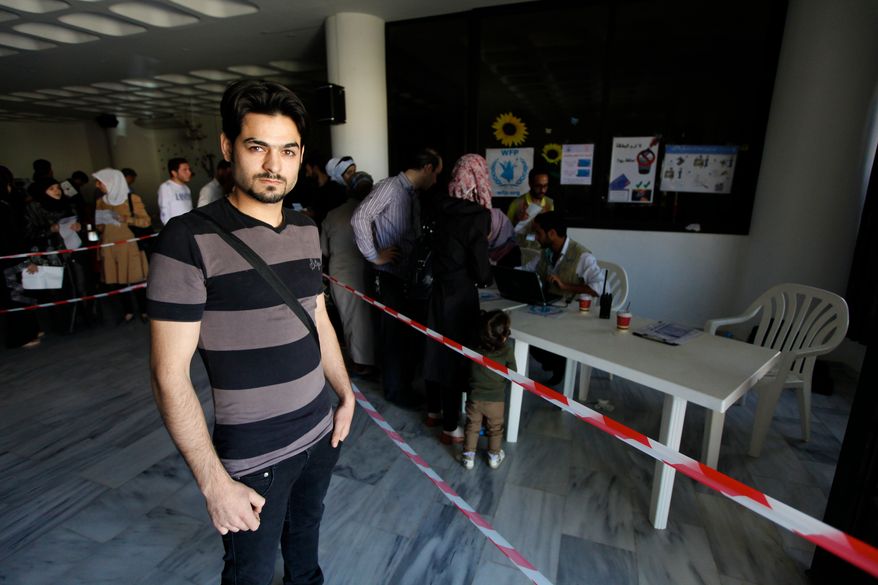 Wissam, 26, arrived in Lebanon from Aleppo with his wife and son. He doesn't receive the aid of $30, but his wife and son each receive $30 as part of the e-card program. Photo by Omar Alkalouti