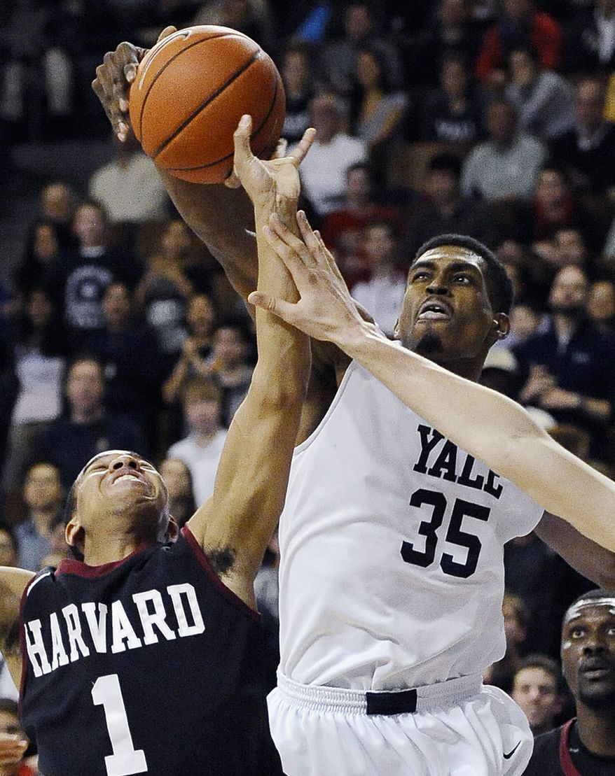 FILE - In this March 7, 2014 file photo, Yale's Brandon Sherrod, right, fouls Harvard's Siyani Chambers, left, during the second half of an NCAA college basketball game in New Haven, Conn. Sherrod is taking off from the team's 2014-15 season to tour with the Whiffenpoofs, the school's a cappella singing group. (AP Photo/Jessica Hill, File)
