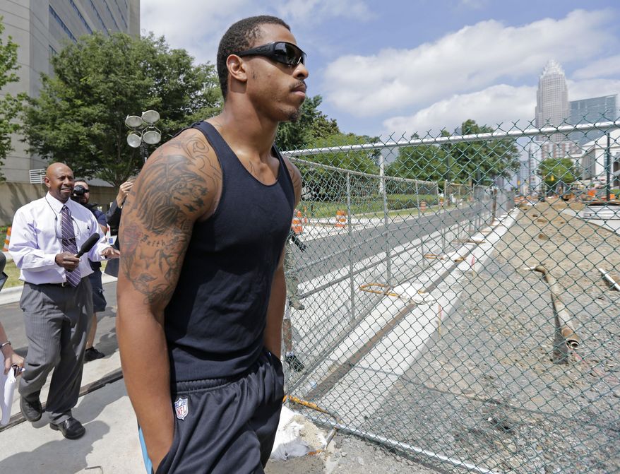 Carolina Panthers NFL football defensive end Greg Hardy leaves the Mecklenburg County jail after being released on bond in Charlotte, N.C., Wednesday, May 14, 2014. Hardy was arrested Tuesday and charged with assault on a female and communicating threats. (AP Photo)