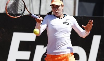 United States' Christina McHale returns the ball to  Italy's Camila Giorgi at the Italian open tennis tournament in Rome, Wednesday, May 14, 2014. (AP Photo/Riccardo De Luca)