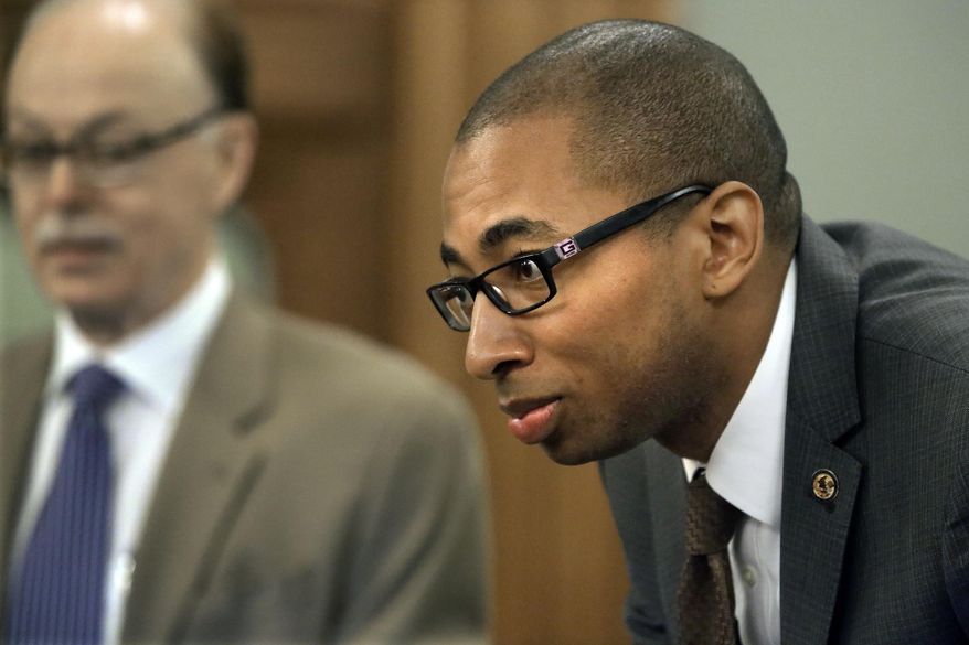 Illinois Rep. Christian Mitchell, D-Chicago, speaks to lawmakers during a committee hearing at the Illinois State Capitol Wednesday, May 14, 2014, in Springfield, Ill. As they craft their own state budget proposal, lawmakers face a number of options in how to proceed while Democratic leaders are still trying to wrangle the votes for the extension of an income tax hike needed to fund it. (AP Photo)