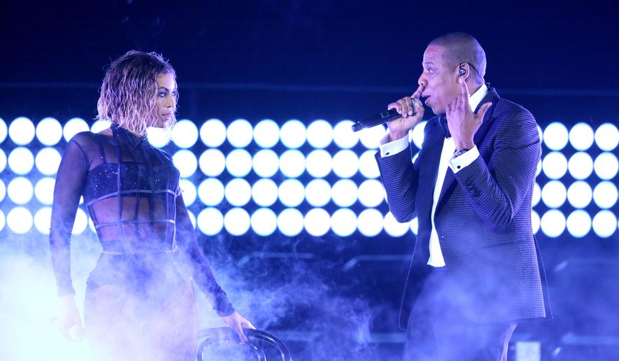 FILE - This Jan. 26, 2014 file photo shows Beyonce, left, and Jay Z performing &amp;quot;Drunk in Love&amp;quot; at the 56th annual Grammy Awards in Los Angeles. Beyoncé and Jay Z lead in nominations for the BET Awards. The network announced Wednesday that the performers are both nominated for five awards, along with Drake. Pharrell and rising performer August Alsina have four nominations. The BET Awards will air live on June 29 from the Nokia Theatre L.A. Live. (Photo by Matt Sayles/Invision/AP, File)