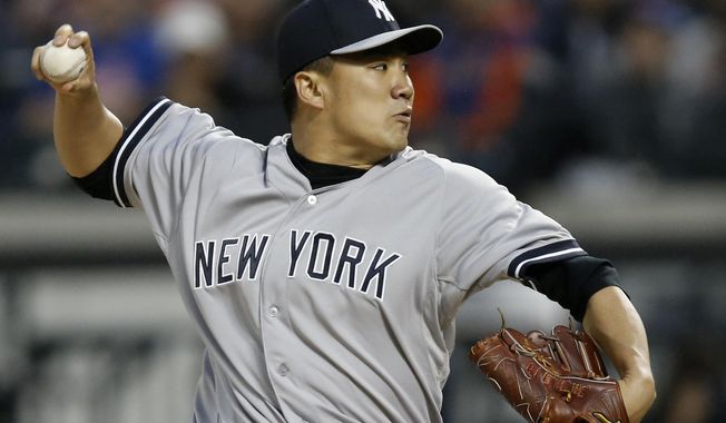 New York Yankees starting pitcher Masahiro Tanaka (19) delivers in the first inning against the New York Mets in a baseball game in New York, Wednesday, May 14, 2014. (AP Photo/)