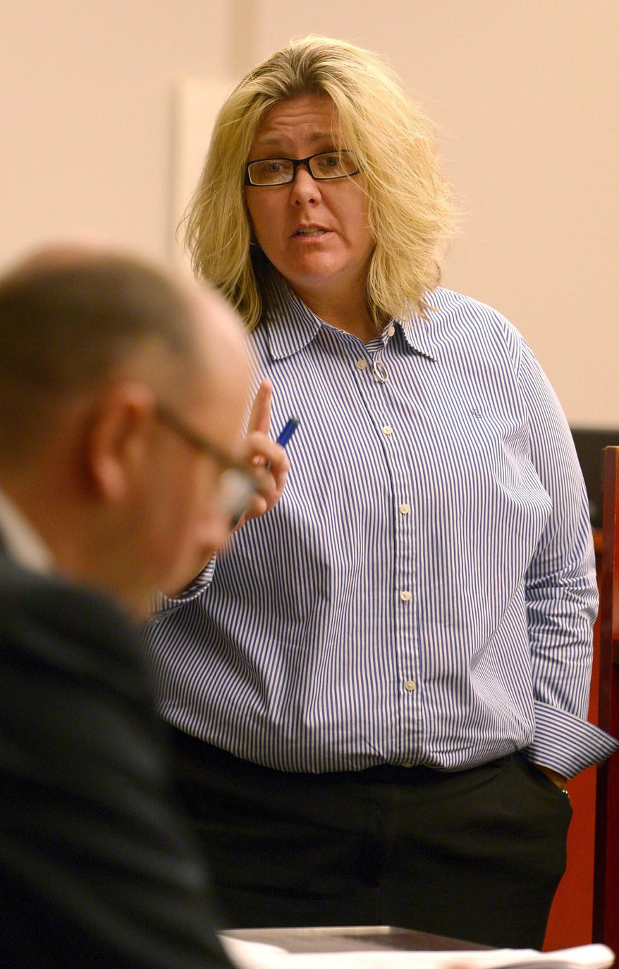 Esar Met's defense attorney Denise Porter addresses court and victim Hser Ner Moo’s family to during Met's sentencing hearing Wednesday, May 14, 2014, in Salt Lake City, Utah. Porter sadi: "Everyone here wishes there was something we could do to bring her back." Met, a 27-year-old Burmese refugee and convicted of killing a 7-year-old girl from his Utah neighborhood, was sentenced to life without possibility of parole. (AP Photo/The Salt Lake Tribune, Leah Hogsten, Pool)