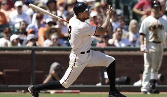 San Francisco Giants&#39; Hunter Pence doubles to score Gregor Blanco during the fifth inning of a baseball game against the Atlanta Braves in San Francisco, Wednesday, May 14, 2014. (AP Photo)