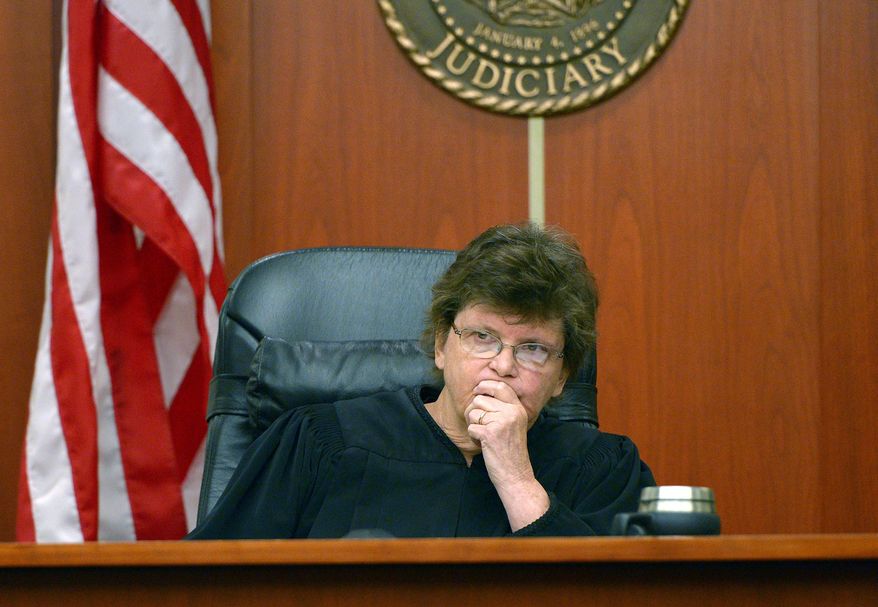 Judge Judith Atherton listens as defense attorney Denise Porter pleads for a lesser sentence for her client Esar Met during Met's sentencing hearing Wednesday, May 14, 2014, in Salt Lake City, Utah. Met, a 27-year-old Burmese refugee and convicted of killing a 7-year-old girl from his Utah neighborhood, was sentenced to life without possibility of parole. (AP Photo/The Salt Lake Tribune, Leah Hogsten, Pool)