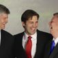 Republican Senate hopeful Ben Sasse, center, laughs with Rep. Jeff Fortenberry, R-Neb., left, and Neb. Gov. Dave Heineman in Lincoln, Neb., Tuesday, May 13, 2014, after winning his party&#x27;s primary election. A crowd of Republican candidates jockeyed to succeed Nebraska&#x27;s outgoing governor and senior U.S. senator in a busy primary election where voters also were set to select nominees for three other vacant offices. (AP Photo)