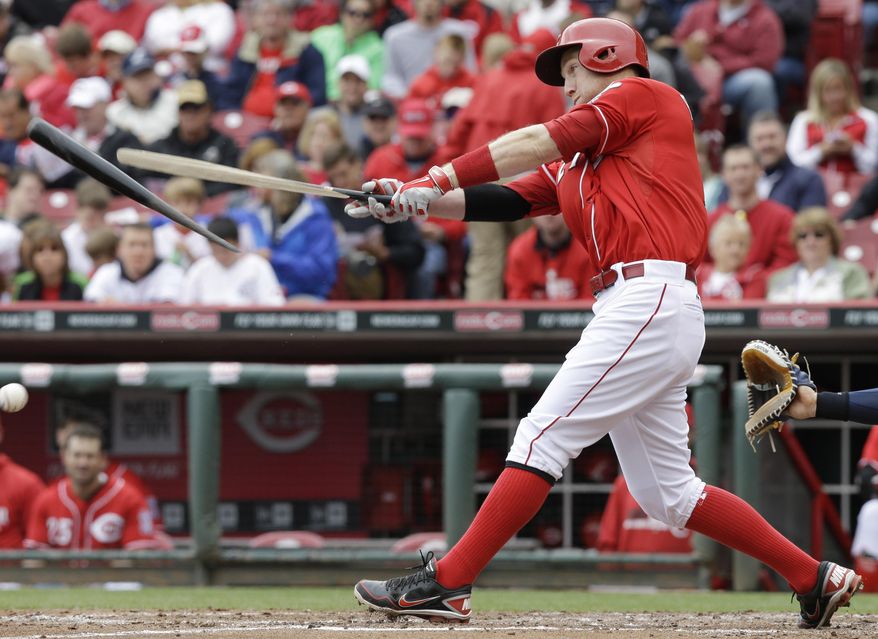 Cincinnati Reds' Todd Frazier breaks a bat hitting a foul ball off San Diego Padres starting pitcher Ian Kennedy in the fourth inning of a baseball game, Thursday, May 15, 2014, in Cincinnati. Frazier hit a single later in the at bat. (AP Photo/Al Behrman)