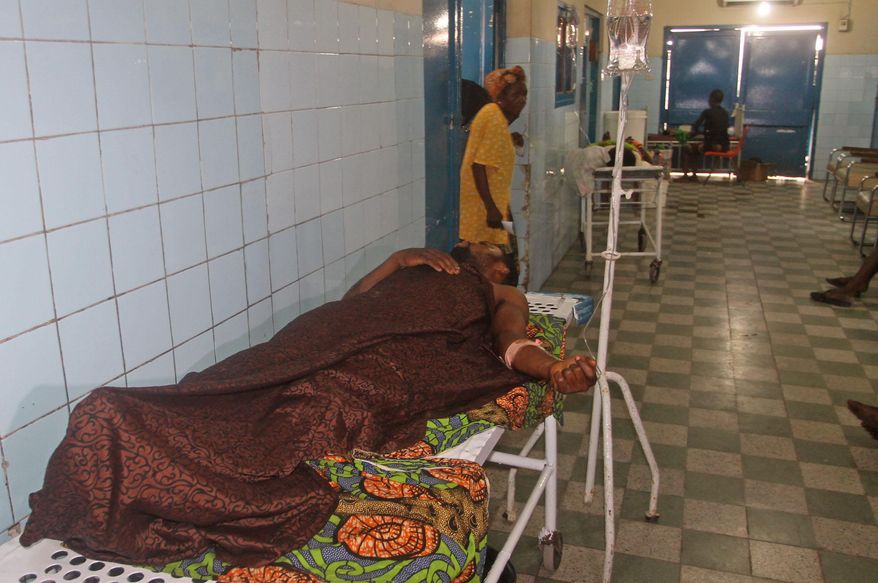 A man receives treatment at a local hospital after a stampede during a soccer game in the city of Kinshasa, Democratic Republic of Congo, Monday, May 12, 2014. The stampede at a soccer stadium in Congo’s capital on Sunday killed at least 15 people and injured more than a dozen, government officials said. (AP Photo/John Bompengo)