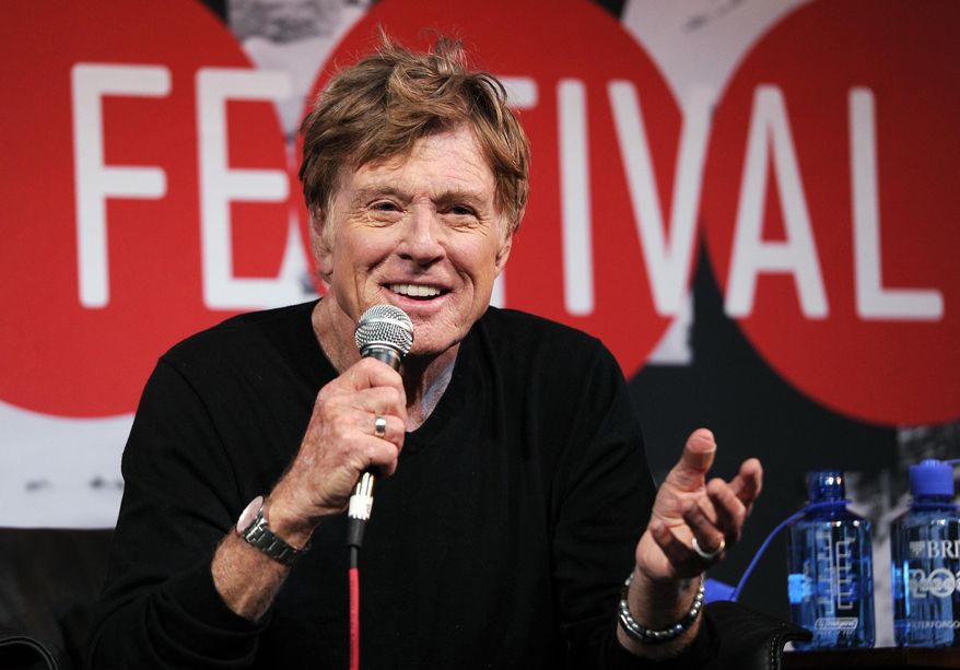 FILE - In this Jan. 16, 2014 file photo, Robert Redford, founder and president of the Sundance Institute, addresses reporters during the opening news conference of the 2014 Sundance Film Festival in Park City, Utah. Visitors spent more and stayed a little longer during this year's Sundance Film Festival, leading to a larger economic impact to the state than the previous year, shows a new University of Utah report released Thursday, May 15, 2014. Gov. Gary Herbert, who recently honored the Sundance founder Redford for his cultural and economic contributions to Utah, lauded the festival for its continued impact on the state. (Photo by Chris Pizzello/Invision/AP, file)