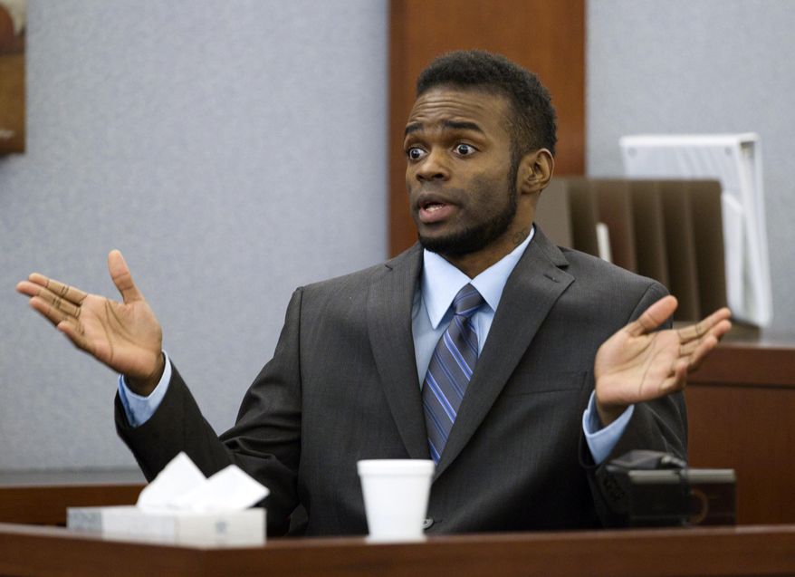 Defendant Jason Omar Griffith speaks to the jury as he testifies in his own defense during his trial at the Regional Justice Center in Las Vegas Wednesday, May 14, 2014. Griffith is accused of murdering Luxor "Fantasy" dancer Deborah Flores Narvaez in December 2010. (AP Photo/The Las Vegas Sun, Steve Marcus) LAS VEGAS REVIEW-JOURNAL OUT