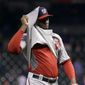 Washington Nationals relief pitcher Rafael Soriano untucks his jersey after the final out of the Nationals&#39; baseball game against the Houston Astros on Tuesday, April 29, 2014, in Houston. The Nationals won 4-3. (AP Photo/David J. Phillip)