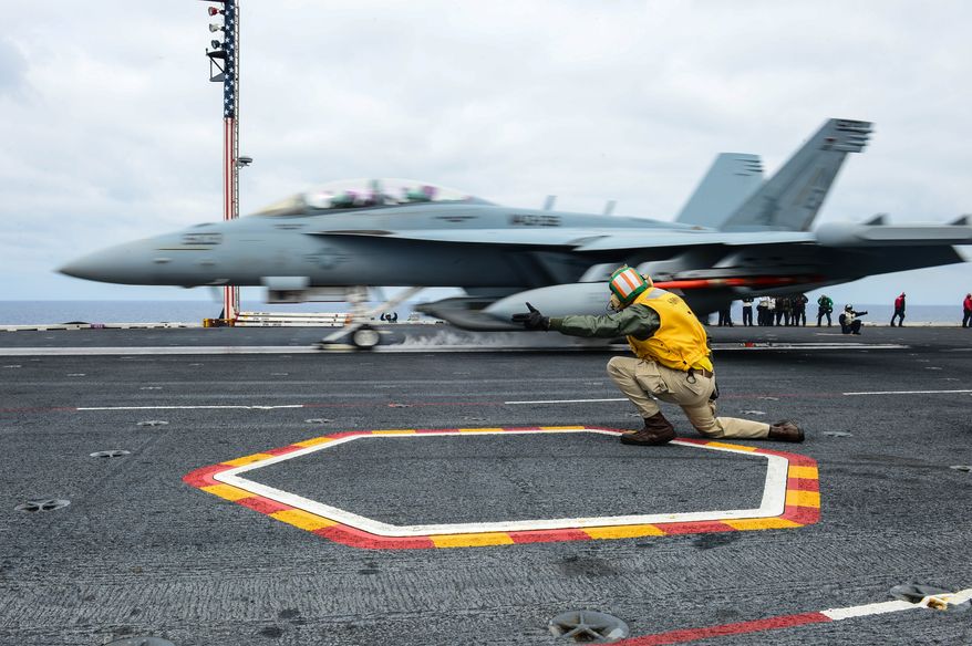 PACIFIC OCEAN (March 24, 2014) Lt. Sean Dougherty, from Quakertown, Pa., shoots an EA-18G Growler assigned to the &amp;#226;&amp;#8364;&amp;#339;Gauntlets&amp;#226;&amp;#8364; of Electronic Attack Squadron (VAQ) 136 from a catapult on the flight deck of the aircraft carrier USS Ronald Reagan (CVN 76). Ronald Reagan is underway conducting tailored ship&amp;#226;&amp;#8364;&amp;#8482;s training availability. (U.S. Navy photo by Mass Communication Specialist Seaman Jonathan Nelson/Released) 140324-N-WO404-275Join the conversationhttp://www.navy.mil/viewGallery.asphttp://www.facebook.com/USNavyhttp://www.twitter.com/USNavyhttp://navylive.dodlive.milhttp://pinterest.comhttps://plus.google.com