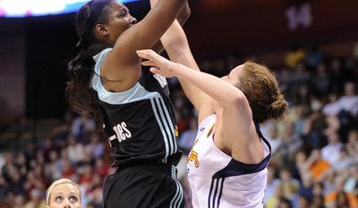 New York Liberty&#x27;s Delisha Milton-Jones, left, shoots over Connecticut Sun&#x27;s Kelsey Griffin, right,  during the first half of their WNBA basketball game in Uncasville, Conn., Friday, May 16, 2014. (AP Photo/Fred Beckham)