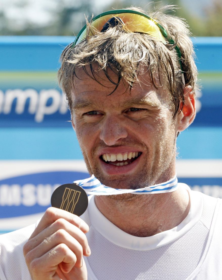 FILE -  In this Saturday, Sept. 3, 2011 file  photo, British rower Alan Campbell displays his bronze medal on the podium after the Men's Single Sculls Final event at the World Rowing Championships in Bled, Slovenia.  An abscessed lower left wisdom tooth threatened to keep British rower Alan Campbell from the 2008 Beijing Olympics. The infection spread to his shoulder, back and eventually settled in his right knee, requiring surgery two months before the games and ruining his training. He placed fifth in the Olympic single sculls final and feels “I certainly would have gone quicker” had the infected tooth not laid him so low, keeping him out of his boat for six weeks. t the London Games four years later, Campbell won bronze. He is adamant that taking better care of his teeth has helped him row faster. He says he now flosses more, tends to drink water rather than sugary drinks, is “more aware of how important dental hygiene is to me and my body” and “if I thought I had any problems I would just have a tooth removed.” (AP Photo/Filip Horvat, File)
