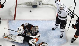 Los Angeles Kings center Mike Richards, right, celebrates his goal past Anaheim Ducks goalie John Gibson during the first period in Game 7 of an NHL hockey second-round Stanley Cup playoff series in Anaheim, Calif., Friday, May 16, 2014. (AP Photo/Chris Carlson)