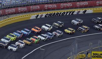 Drivers navigate Turn 4 as they approach the start of the NASCAR Sprint Showdown auto race at the Charlotte Motor Speedway in Concord, N.C., Friday, May 16, 2014. (AP Photo/Gerry Broome)