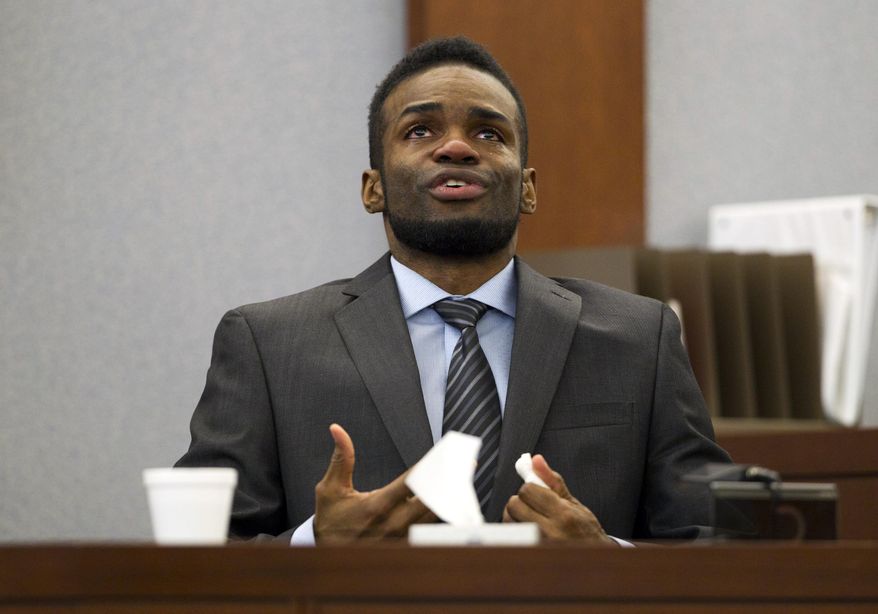 Defendant Jason Omar Griffith becomes emotional as he testifies in his own defense during his trial at the Regional Justice Center in Las Vegas Thursday, May 15, 2014. Griffith testified that he accidentally killed dancer Deborah Flores Narvaez during a struggle in December 2010. (AP Photo/The Las Vegas Sun,Steve Marcus) LAS VEGAS REVIEW-JOURNAL OUT