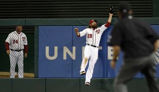 Washington Nationals right fielder Jayson Werth jumps to make a catch on a fly ball hit by New York Mets&#39; Daniel Murphy, for the final out of the ninth inning of a baseball game at Nationals Park Friday, May 16, 2014, in Washington. The Nationals won 5-2. (AP Photo/Alex Brandon)