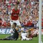 Arsenal&#39;s Laurent Koscielny, bottom right,  holds his leg after taking a knock when scoring his sides second goal during the English FA Cup final soccer match between Arsenal and Hull City at Wembley Stadium in London, Saturday, May 17, 2014. (AP Photo/Kirsty Wigglesworth)