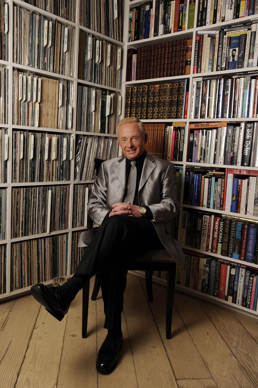 n this Tuesday, April 29, 2014 photo, Elliot Mintz poses for a portrait in his library at his home in Beverly Hills, Calif. Determined to retire after five decades in Hollywood, the 69-year-old is releasing what he calls a “cyberography”: A free website, ElliotMintz.com launching on May 18, 2014, filled with more than 150 hours of his radio and TV interviews comprising hundreds of celebrities and subjects. There’s free advice for Hollywood hopefuls; intimate discussions with Salvador Dali and John Coltrane; even meditation lessons from spiritual teacher Baba Ram Dass. (Photo by Chris Pizzello/Invision/AP)