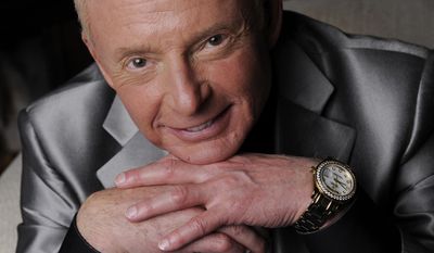 In this Tuesday, April 29, 2014 photo, Elliot Mintz poses for a portrait at his home in Beverly Hills, Calif. Determined to retire after five decades in Hollywood, the 69-year-old is releasing what he calls a “cyberography”: A free website filled with more than 150 hours of his radio and TV interviews comprising hundreds of celebrities and subjects. ElliotMintz.com goes live Sunday, May 18, 2014. (Photo by Chris Pizzello/Invision/AP)