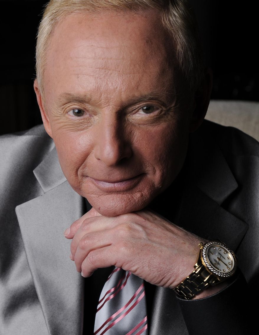 In this Tuesday, April 29, 2014 photo, Elliot Mintz poses for a portrait at his home in Beverly Hills, Calif. Determined to retire after five decades in Hollywood, the 69-year-old is releasing what he calls a “cyberography”: A free website, ElliotMintz.com launching May 18, 2014, filled with more than 150 hours of his radio and TV interviews comprising hundreds of celebrities and subjects. There’s advice for Hollywood hopefuls; intimate discussions with Salvador Dali and Timothy Leary; even meditation lessons from professor-turned-spiritual teacher Baba Ram Dass. (Photo by Chris Pizzello/Invision/AP)